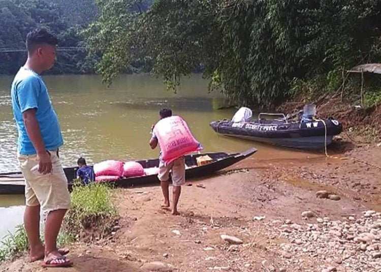 Bad road forced group to ferry aid items by boat