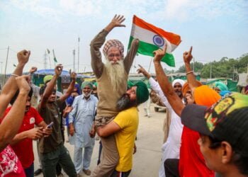 Farmers at Delhi borders celebrate but say they won’t budge till Parliament repels agri laws