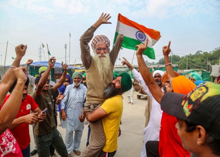 Farmers at Delhi borders celebrate but say they won’t budge till Parliament repels agri laws