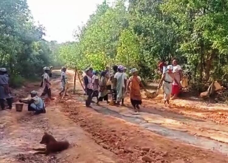 Border women repair own road
