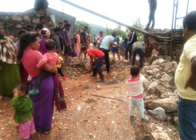 Umlaper villagers dismantle wall constructed on road