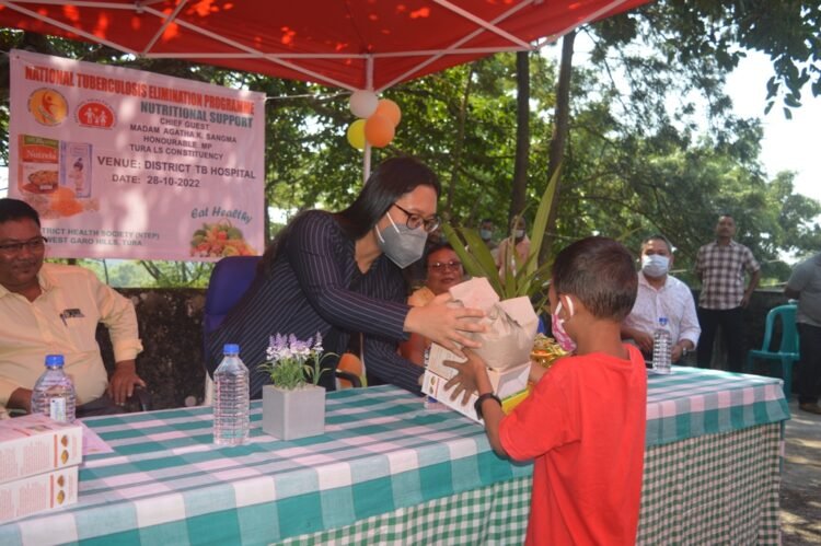 Agatha distributes food baskets to patients at Tura TB Hospital