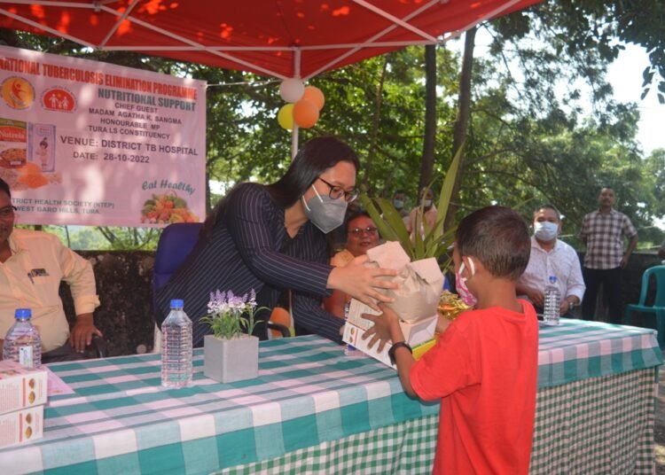 Agatha distributes food baskets to patients at Tura TB Hospital