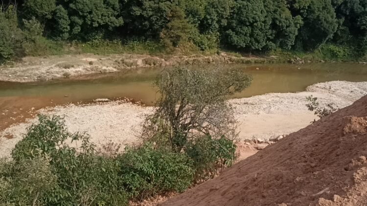 Myntdu River being choked with mud due to road construction