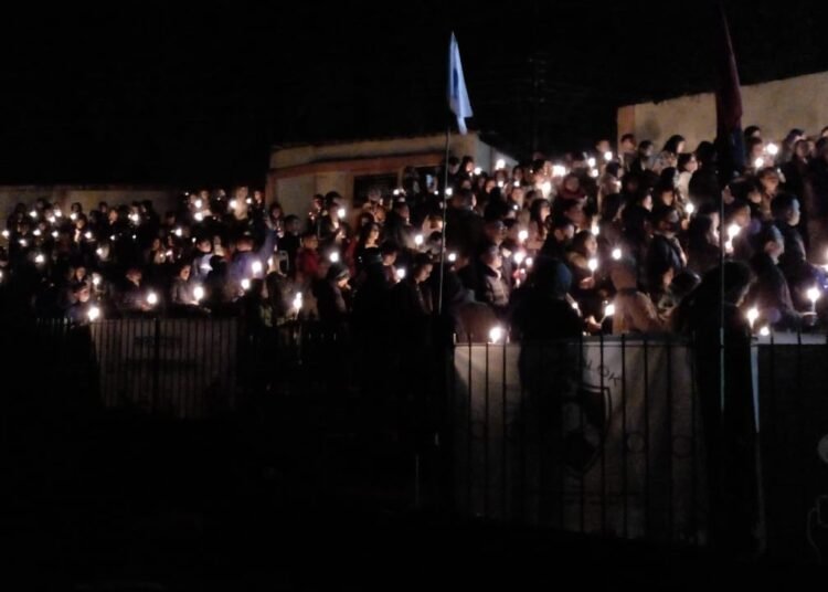 Candlelight vigil held for youth killed by police escort