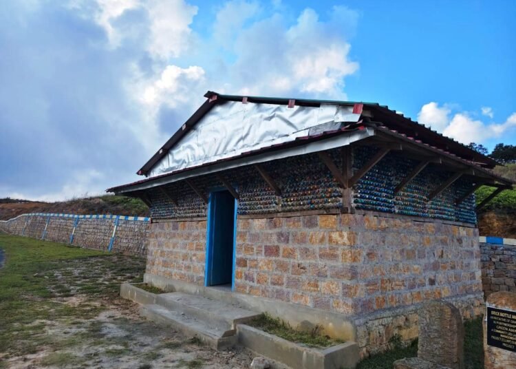 Community efforts convert plastic trash to tourist shed