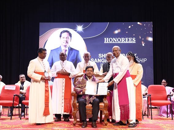 Conrad gets award from Catholic Bishops