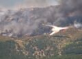 90,000 people flee raging wildfires in France and Spain, some escaping by boat