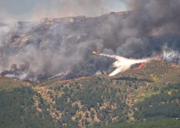 90,000 people flee raging wildfires in France and Spain, some escaping by boat