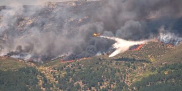 90,000 people flee raging wildfires in France and Spain, some escaping by boat