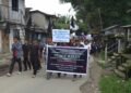 Village rallies to condemn murder