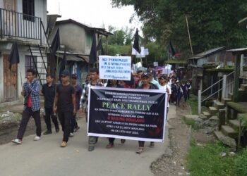 Village rallies to condemn murder