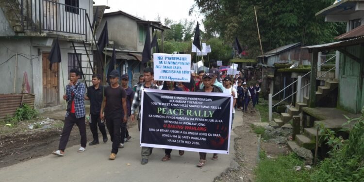 Village rallies to condemn murder
