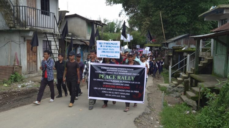 Village rallies to condemn murder