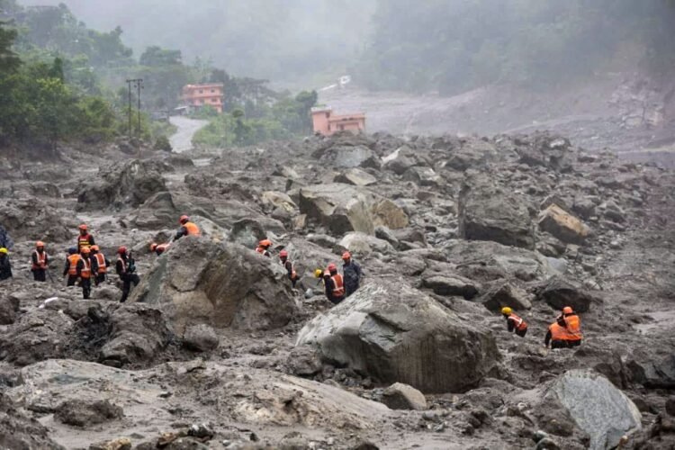 Nepal digs through mud and grief, as families search for loved ones