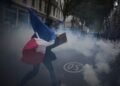More than 400,000 protest across France, challenging Macron as Paris clashes erupt
