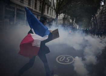 More than 400,000 protest across France, challenging Macron as Paris clashes erupt