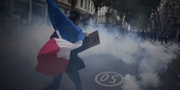 More than 400,000 protest across France, challenging Macron as Paris clashes erupt
