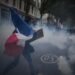 More than 400,000 protest across France, challenging Macron as Paris clashes erupt